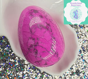 Pink Howlite Crystal Egg layed on trinket tray